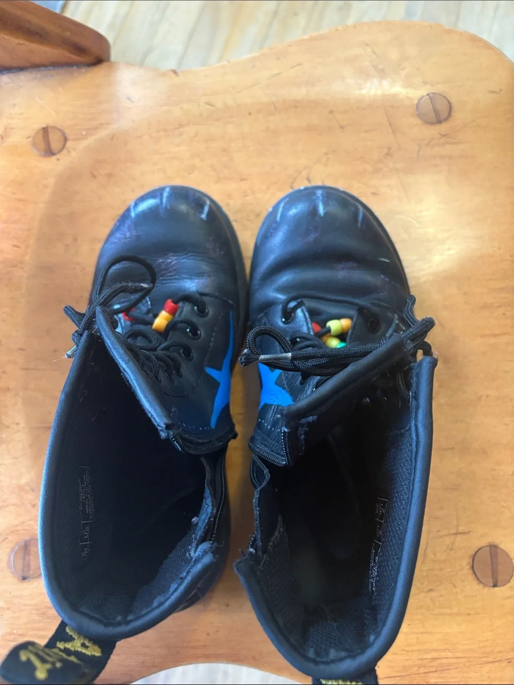 Dr. Martens Black Leather Unisex Kids Lace-Up Boots with Original Paint Artwork